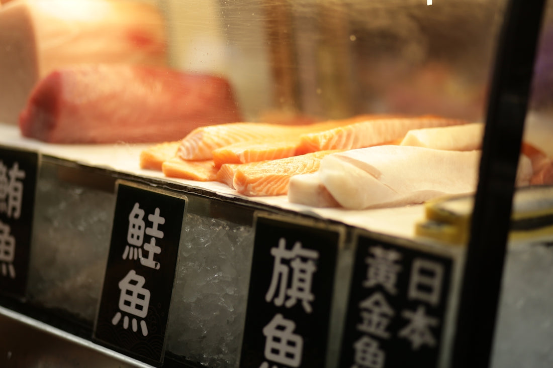 Fresh raw fish fillets displayed on ice